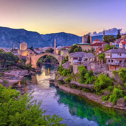 The Neretva river winding through the old UNESCO listed, Mostar bridge in Bosnia and Herzegovina.